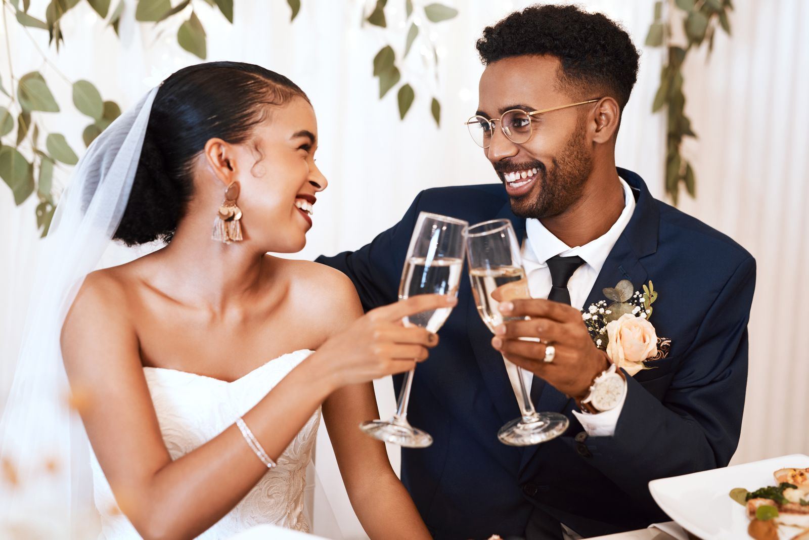 Bride and groom toasting at their wedding reception
